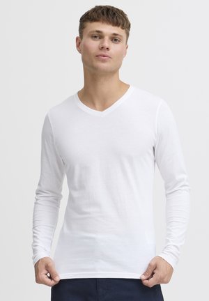 Long-sleeve white V-neck t-shirt, made of soft fabric, featuring a fitted design and minimal seams for a clean look.