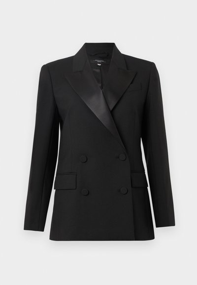 Blazer noir à double boutonnage avec revers en satin, épaules structurées et deux poches latérales. Fabriqué en tissu tissé au toucher lisse.
