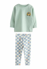 Green sweatshirt with embroidered yellow car; paired with blue and white checkered leggings featuring small animal motifs.