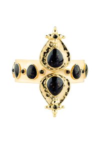 Bague en métal doré ornée de pierres en forme de goutte noire avec des éclats dorés, agrémentée de détails sphériques et d'un motif en croix.