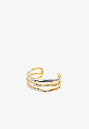 Cuff bracelet featuring intertwined metal strands in gold and silver, with a wavy design and polished finish. Open-ended style for adjustable fit.