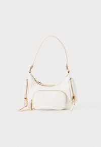 White handbag with a short strap, textured surface, multiple zippered pockets, and gold-tone hardware accents. Compact and modern design.