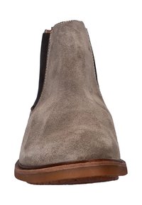 Beige suède Chelsea-laarzen met elastische zijpanelen, ronde neus en een bruine rubberen zool. Glad oppervlak met een matte afwerking en zichtbare stiksels.