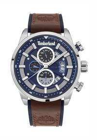 Orologio cronografo Timberland con cassa in acciaio inossidabile, quadrante blu, cinturino in pelle marrone e dettagli argentati. Presenta tre quadranti secondari.