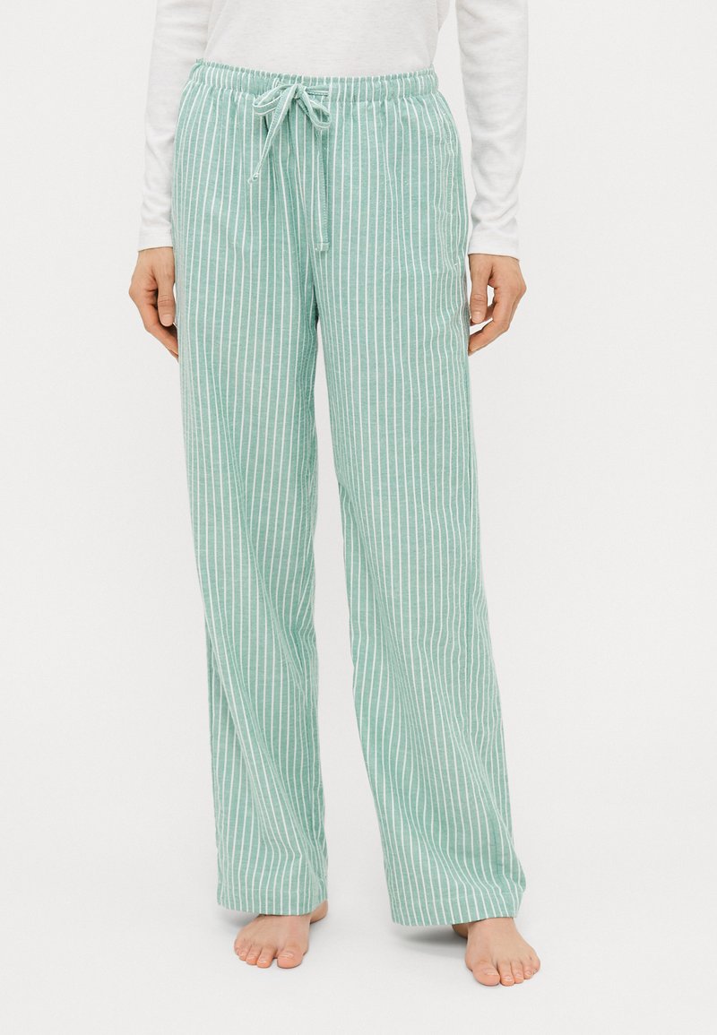 Pantaloni da pigiama verde chiaro con strisce verticali bianche, dotati di una vita elastica con cordoncino e un design rilassato e a gamba larga.