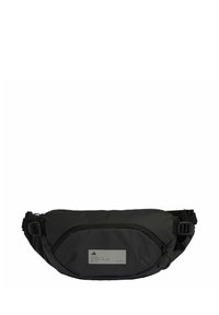 Black fanny pack made of nylon, featuring a front zippered pocket, adjustable strap, and a rectangular gray label with text.