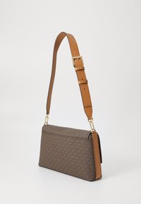 Brown monogrammed handbag with a flat shape, tan leather accents, gold hardware, and an adjustable strap. Smooth texture throughout.