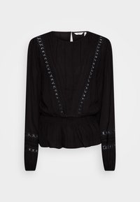 Mustapaita, joka on valmistettu tekstuurikankaasta, jossa on pitkät hihat, kerätty vyötärö ja koristeellinen brodeeraus kaula-aukon ja hihojen ympärillä.