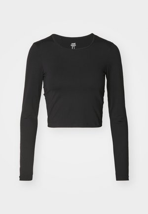 Svart langermet cropped topp laget av glatt, elastisk stoff. Har en rund halslinning og et tettsittende design med minimale søm detaljer.