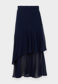 Jupe midi asymétrique bleu marine avec un tissu superposé et transparent, dotée d'une taille ajustée.