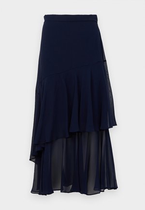 Marineblaue asymmetrische Midibluse mit schichtartigem, transparentem Stoff und einem taillierten Bund.