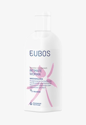 Weiße Flasche der EUBOS Intimate Woman Waschemulsion mit rosa Blumenmotiv und deutschem Text über die pH-ausgewogene Formel.