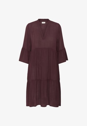 Burgundy tiered dress made of lightweight fabric with a V-neck and short, flared sleeves; features a ruffled neckline and smooth texture.