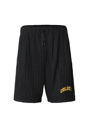 Shorts en maille noire avec une ceinture élastique, un cordon de serrage et le texte jaune "COLUC" sur la partie inférieure droite de la jambe.