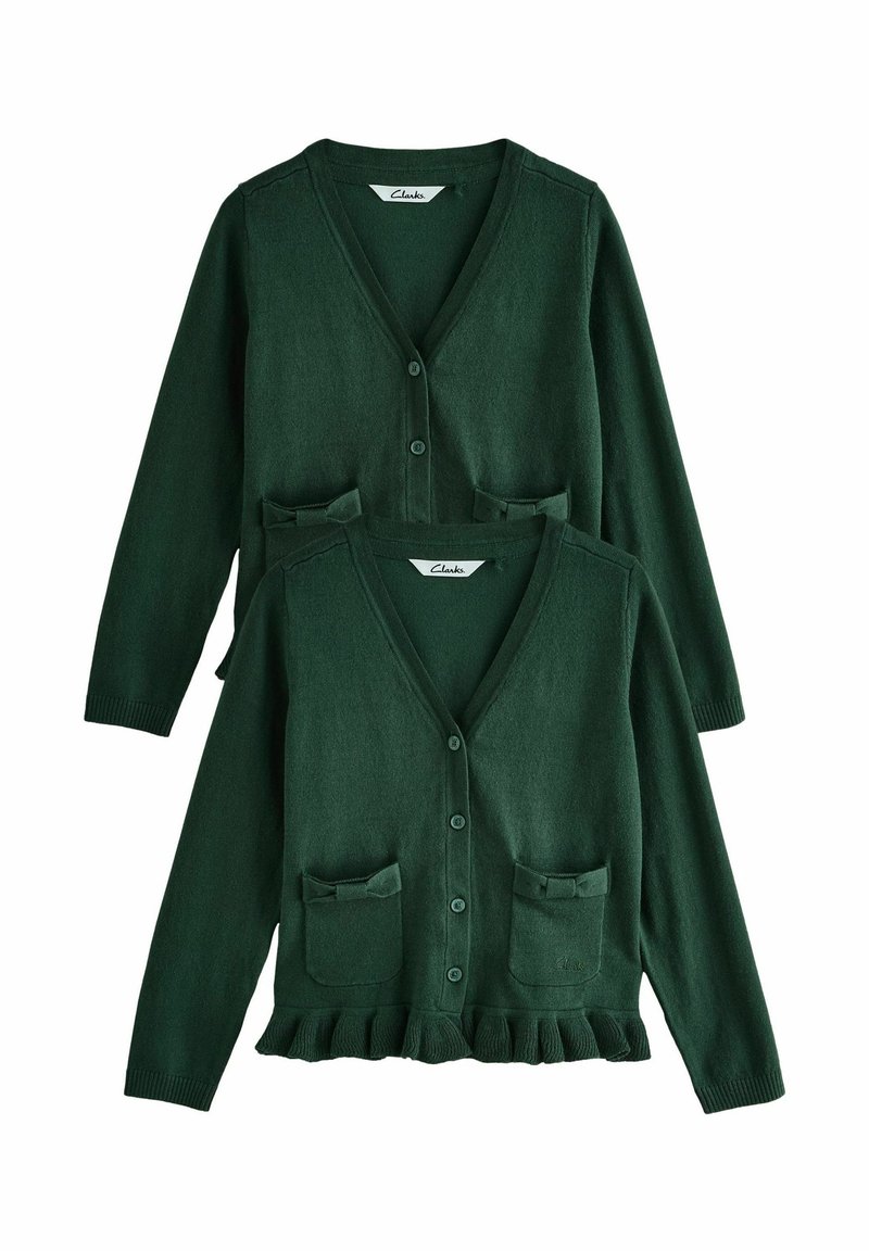 Mörkgrön cardigan med V-hals, knäppning, två framfickor med rosetter och en volangkant. Mjuk, texturerad stickad kvalitet.