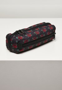 Black pencil case with red rose pattern, zip closure, and textured fabric. Compact rectangular shape with dual compartments.