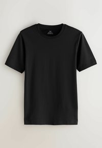 Vienkrāsaina melna īsroku T-krekls ar apaļu kakla izgriezumu un muskuļu pieguļošu piegriezumu, attēlots uz neitrālas gaišas fona.