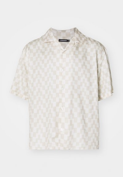 Short-sleeve shirt with a cream and beige geometric pattern, lightweight fabric, notch collar, and five buttons down the front.