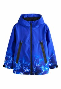 Blue waterproof jacket with a hood, featuring black zippered pockets and a lightning pattern at the hem, made from durable material.