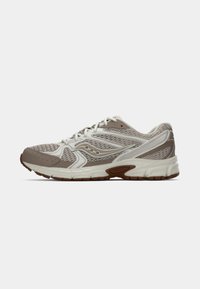 Lightweight running shoe in beige and white. Features mesh upper, textured design, rubber sole, and prominent eyelets for laces.