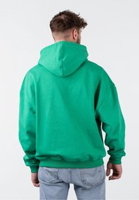 PEQUS Jersey con capucha - green