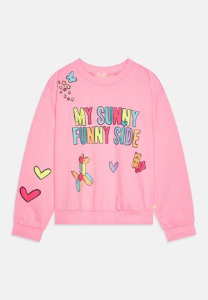 Rózsaszín polár pulóver színes "A NAPSÜTÖT FUNNY OLDALAM" felirattal, szívecskékkel, lufikkal és rajzfilmszerű medve grafikákkal díszítve.