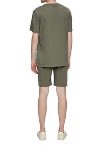 QS Pantalones deportivos - olivgrün