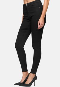 Elara STRETCH - Vaqueros pitillo - schwarz