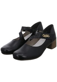 Chaussures en cuir noir avec un design à bride en T, détails découpés, accent doré et talon bas en bois. Texture lisse et bout arrondi.