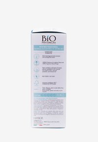 Packaging della Eco Bio Maschera in una scatola bianca con accenti turchesi. Presenta informazioni sul prodotto, certificazioni ecologiche e dettagli sul riciclaggio in più lingue.