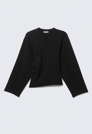 Zwarte cropped t-shirt met lange mouwen van katoen, met een ronde hals en een relaxte pasvorm met brede mouwen en subtiele ruching aan de zijkanten.