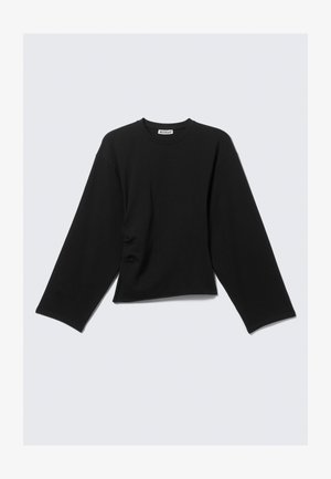 T-shirt cropped à manches longues noir en coton, avec un col rond et une coupe décontractée, des manches larges et un subtil détail de fronces sur les côtés.