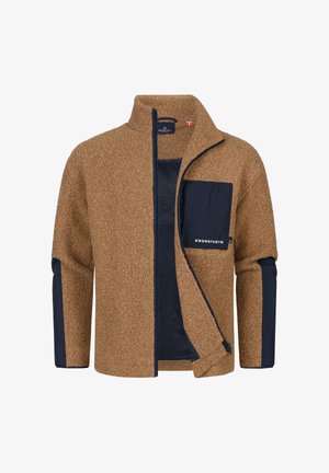 Brun fleecejakke med en marineblå nylonlomme, lynlåse foran, høj krave og kontrasterende marineblå ærmekanter. Mærkets logo på lommen.