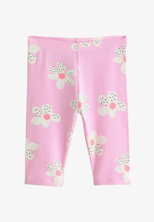 Růžové legíny pro batolata s bílými kopretinami s růžovými středy a černými puntíkovanými okvětními lístky.