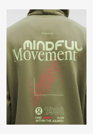 Olive green hoodie featuring "MINDFUL Movement" in light green text and red wavy lines. Includes "lululemon" logo and year "1998" at the bottom.