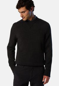 Maglione a maniche lunghe nero lavorato a maglia con collo alto, polsini a coste e un motivo strutturato. Progettato con una vestibilità morbida e un colore solido.