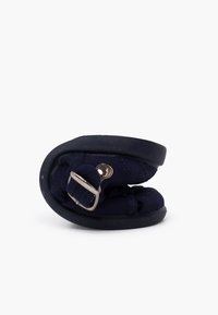 Navy blue, folded shoe with a fabric upper and rubber sole. Features a metal buckle for secure closure. Compact design for easy storage.