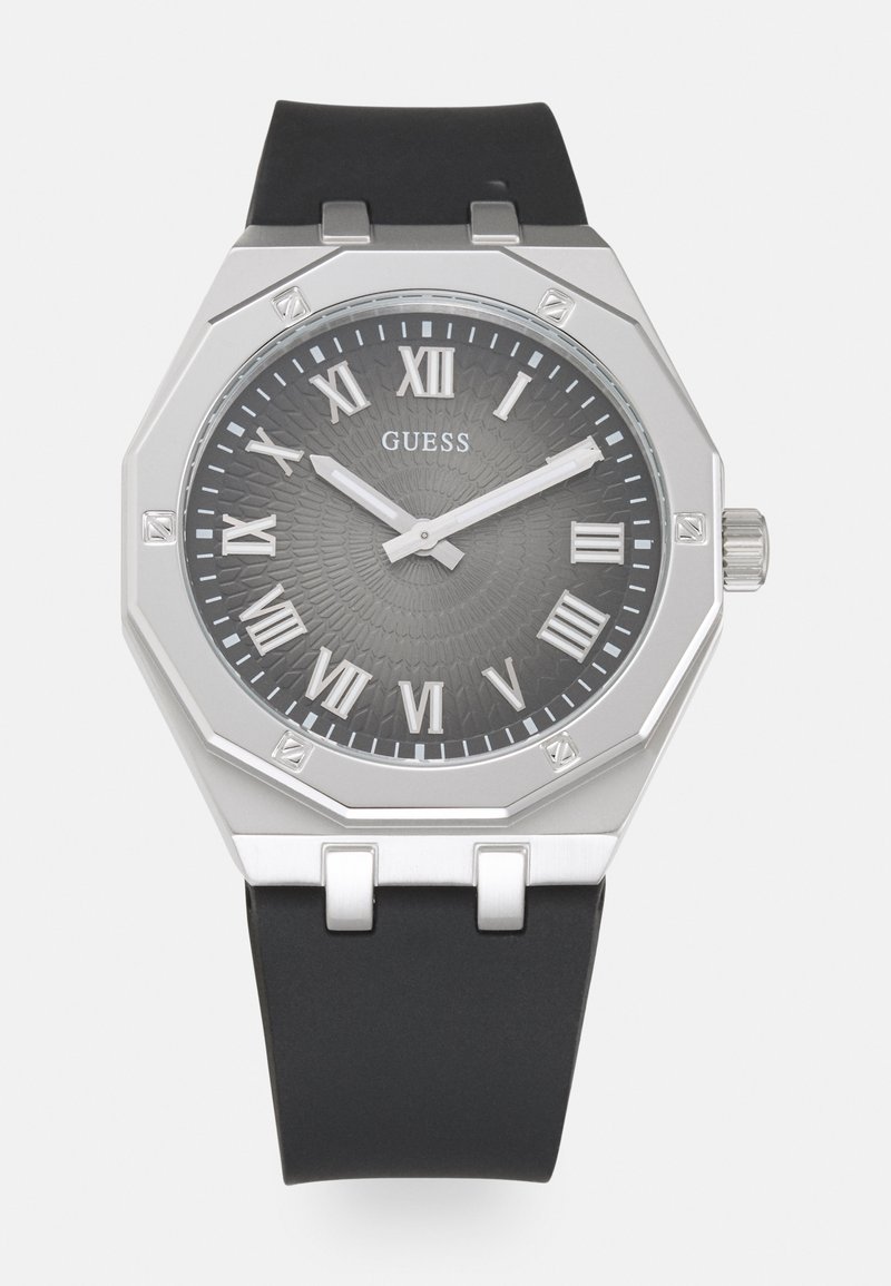 Octagonal watch with a gray textured dial, silver Roman numerals, and silver accents. Features a black rubber strap and crown.
