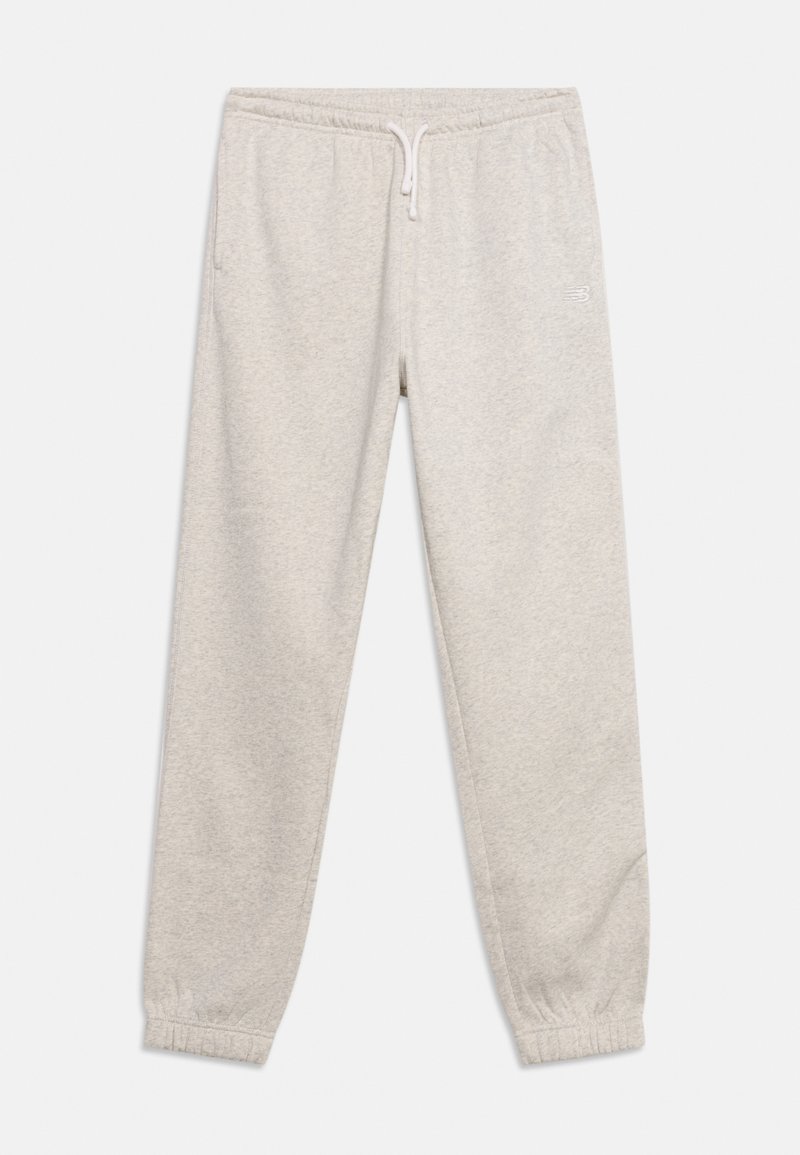 Pantalon de survêtement gris clair avec taille élastique, cordon blanc, poches latérales, poignets élastiques et un petit logo sur la cuisse droite.