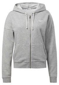 Felpa grigia con zip in materiale morbido, dotata di tasca frontale, cappuccio con cordino e logo Reebok sul lato sinistro del petto.