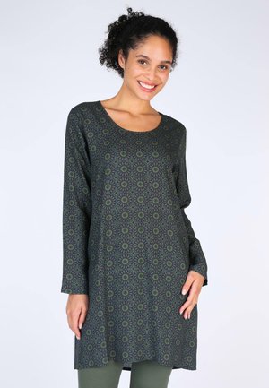 Langärmlige Tunika in Dunkelgrün mit floralen Muster. Hergestellt aus weichem Stoff, hat einen runden Halsausschnitt und eine lockere Passform.