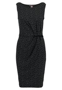 Black sleeveless dress with white polka dots, fitted silhouette, knot detail at the waist, smooth fabric texture, and round neckline.