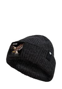 Black knitted beanie featuring an eagle embroidered patch and a small black logo on the side. Textured fabric with a tapered design.