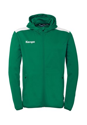 Haut zippé vert avec une texture douce, accents blancs sur les épaules et le logo "Kempa" sur la poitrine. Comprend des poches et une capuche.