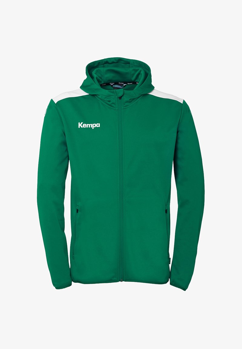 Grøn zip-up hoodie med en blød tekstur, hvide skulderdetaljer og "Kempa" logoet på brystet. Har lommer og hætte.