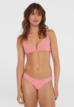 Pink bikini set featuring a structured, v-cut top with wide straps and matching low-rise bottom. Smooth texture, minimalist design.