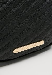 River Island Sac banane - black