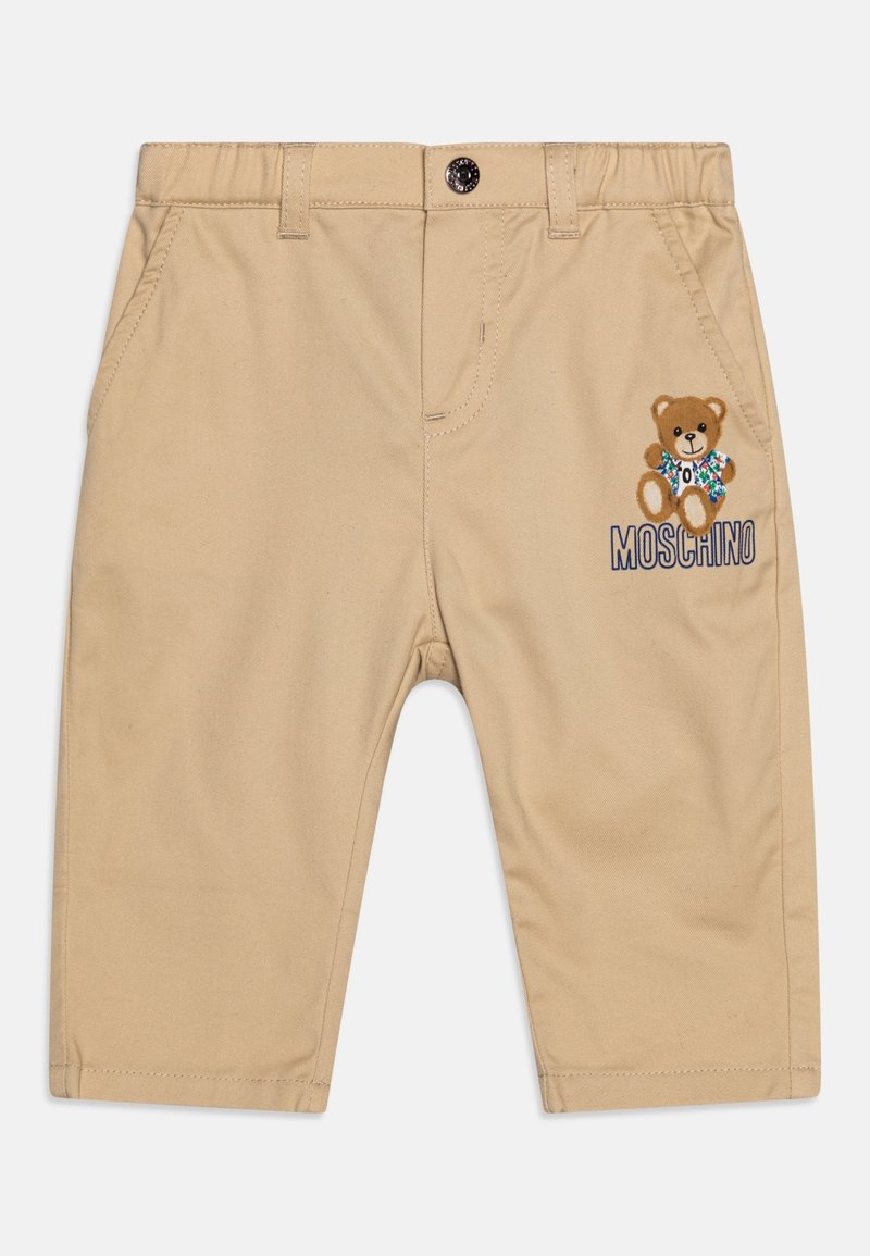 Shorts en coton beige avec taille élastique. Présente une broderie de teddy bear et le texte "Moschino" sur le côté droit. Deux poches avant.