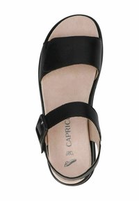 Sandal in pelle nera con due ampie cinghie. Soletta in suede, fibbia regolabile sul lato e suola piatta con forma arrotondata.