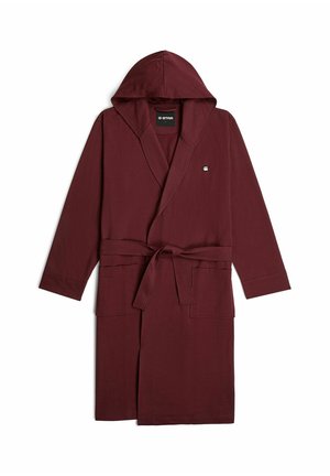 Lange kastanjebruine badjas met capuchon, voorzakken en een ceintuur om de taille, ontworpen voor comfort en casual gebruik.